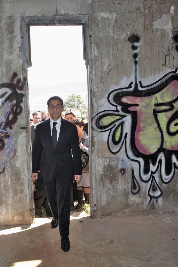 France's President and UMP party candidate for his re-election Sarkozy arrives at the Joffre de Rivesaltes camp, near Perpignan