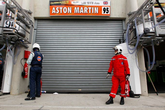 A race steward stands in front of the pit lane of Aston Martin number 95 during the Le Mans 24-hour sportscar race in Le Mans, central France June 22, 2013. The driver of