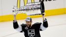 Jun 13, 2014; Los Angeles, CA, USA; Los Angeles Kings defenseman Jake Muzzin (6)hoists the Stanley Cup after defeating the New York Rangers in the second overtime period