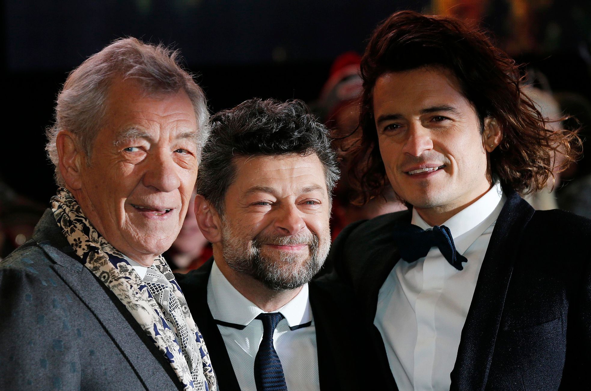 Cast members McKellen and Bloom pose for photographers with second unit director Serkis as they arrive for the world film premiere of &quot;The Hobbit: The Battle of the Five Armies&quot; at Leicester