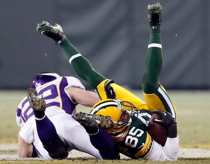 NFL,  John Kuhn (Green Bay Packers) - 30 a Jamarca Sanford (Minnesota Vikings)