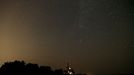 Meteor streaks across the sky over an Orthodox church during the Perseid meteor shower near the village of Malashki