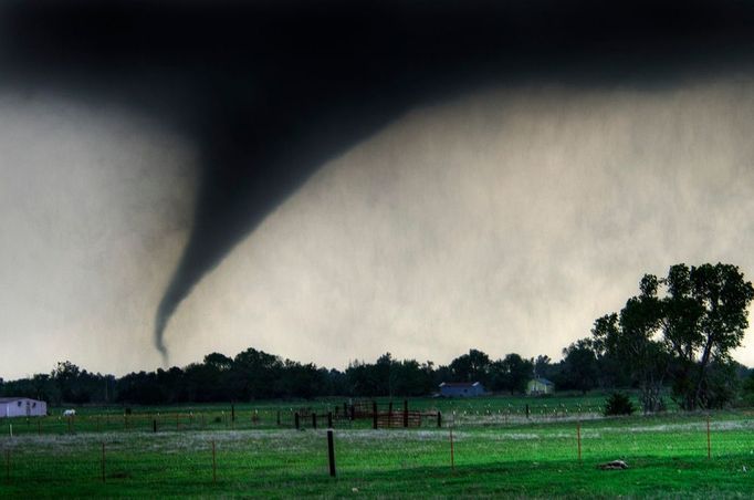 Tornado One of over 100 tornadoes reported in the Central Plains during a torando outbreak on Saturday, April 15, 2012. A deadly torando touched down near Woowdard, OK later that night killing 6 and leaving many injured. This dangerous tornado was shot south of Cheyenne, OK. at sunset. Oklahoma,USA