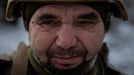 A Ukrainian serviceman of the 93rd separate mechanized brigade attends a Christmas Day service near the front line in the Donetsk region as Ukrainians celebrate their fir