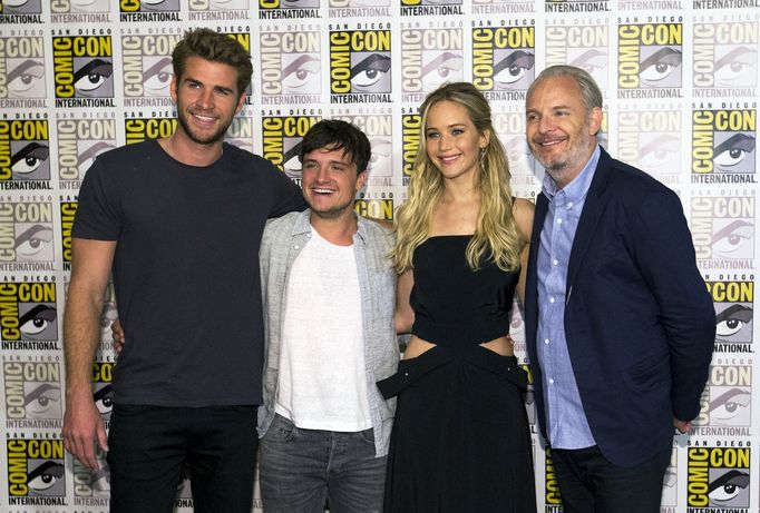 Director of the movie Lawrence poses with cast members Lawrence, Hutcherson and Hemsworth at a press line for &quot;The Hunger Games: Mockingjay - Part 2&quot; during the