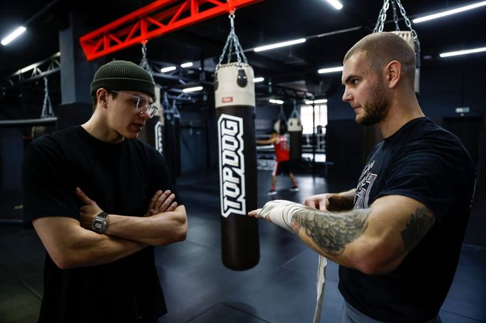 Founder of the "Top Dog" bare-knuckle boxing tournament Danil Andreev speaks with fighter Danik Vesnenok during a training session in Moscow, Russia March 30, 2021. Pictu