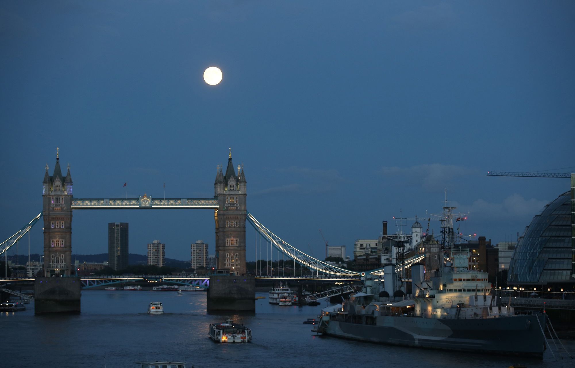 The supermoon rises over Tower Bridge in London