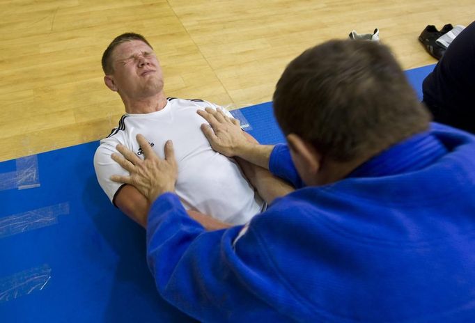 Kazakhstan's judoka Maxim Rakov trains with his coach and father Sergei for the London 2012 Olympics in Almaty