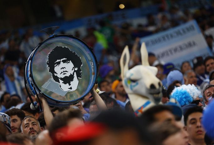 Soccer Football - FIFA World Cup Qatar 2022 - Group C - Argentina v Mexico - Lusail Stadium, Lusail, Qatar - November 26, 2022 Argentina fans with a Diego Maradona pictur