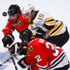 Bruins' Seguin battles for the puck with Chicago Blackhawks'