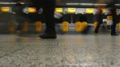 Passengers walk past abandoned desks of German air carrier Lufthansa at the Fraport airport in Frankfurt, September 7, 2012. German air carrier Lufthansa passengers face widespread flight disruption after cabin crew representatives said they continue a series of strikes over pay and cost-cutting measures at Germany's largest airline. The UFO union, which represents around two-thirds of Lufthansa's 19,000 cabin crew called on its members to strike for 24 hours on all German airports on Friday. REUTERS/Kai Pfaffenbach (GERMANY - Tags: TRANSPORT BUSINESS CIVIL UNREST EMPLOYMENT)