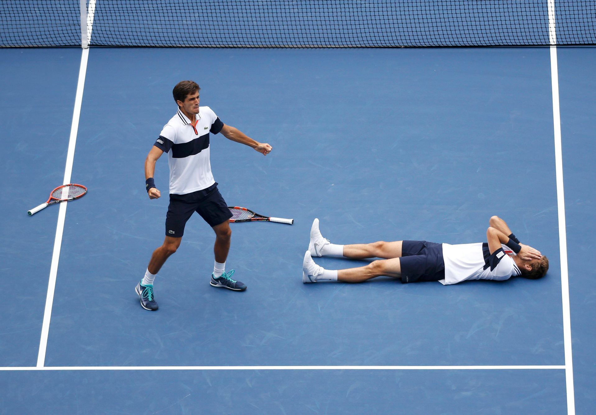 Herbert and Mahut of France celebrate after defeating Murray of Britain and Peers of Australia in the men's doubles final match at the U.S. Open Championships tennis tournament in New York