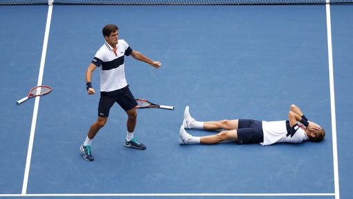 Pierre-Hugues Herbert (L) and Nicolas Mahut of France celebrate after defeating Jamie Murray of Britain and John Peers of Australia in the men's doubles final match at th
