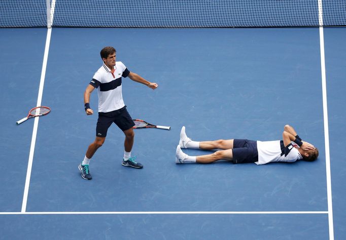 Pierre-Hugues Herbert (L) and Nicolas Mahut of France celebrate after defeating Jamie Murray of Britain and John Peers of Australia in the men's doubles final match at th