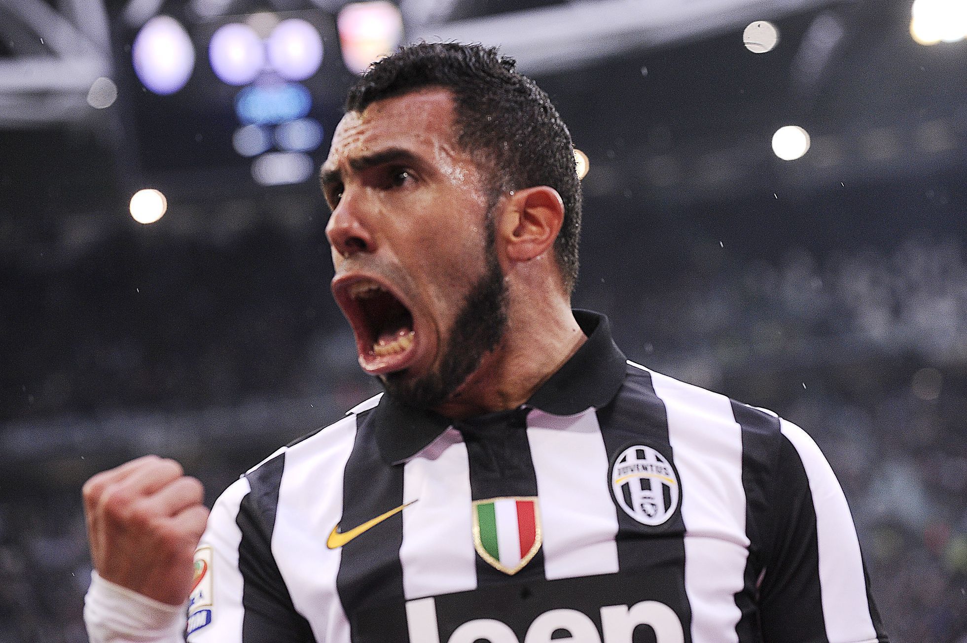 Juventus' Carlos Tevez celebrates after scoring against Genoa during their Italian Serie A soccer match in Turin