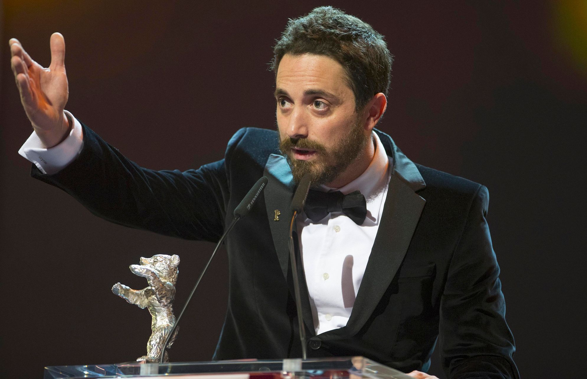 Larrain gestures after receiving the Silver Bear Grand Jury Prize for the film 'El Club' at the awards ceremony of the 65th Berlinale International Film Festival in Berlin