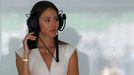 Jessica Michibata, fiancee of McLaren Formula One driver Jenson Button, listens to the radio during the first practice session of the Malaysian F1 Grand Prix at Sepang In