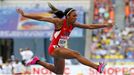 Lashinda Demus of the U.S. clears a hurdle in her women's 400 metres hurdles semi-final during the IAAF World Athletics Championships at the Luzhniki stadium in Moscow Au