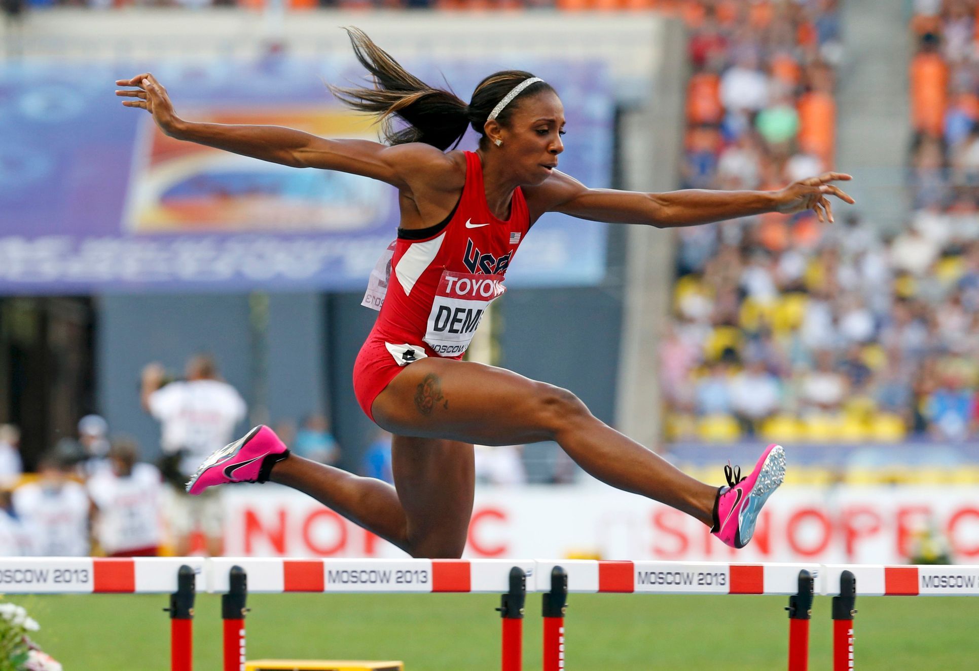 Demus of the U.S. clears a hurdle in her women's 400 metres hurdles semi-final during the IAAF World Athletics Championships in Moscow