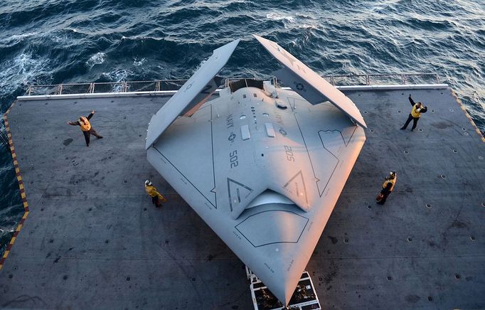 US Navy Launches Drone May 14, 2013 - Virginia Coast, Virginia , U.S. - Sailors move an X-47B onto an aircraft elevator aboard the aircraft carrier USS George H.W. Bush. George H.W. Bush is the first aircraft carrier to successfully catapult launch an unmanned aircraft from its flight deck.