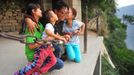 Legless Man Ascends Huashan Mountain By Arms HUAYIN, CHINA - AUGUST 13: (CHINA OUT) Legless man Chen Zhou pose with his family as he climbs the Huashan Mountain on August 13, 2012 in Huayin, Shaanxi Province of China. Legless 29-year-old man Chen Zhou from Cangshan of Shandong Province spent two days, 19 hours in total, climbing by arms to the top of Huashan Mountain. Chen lost his legs after falling off a train at the age of 13, but he has since strived to be stronger and joined in many public performances to encourage other people. Chen Zhou will climb the Taishan Mountain in Shandong province in the following months. ( automatický překlad do češtiny )