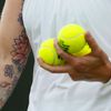 Bethanie Mattek-Sands of the U.S. holds tennis balls during