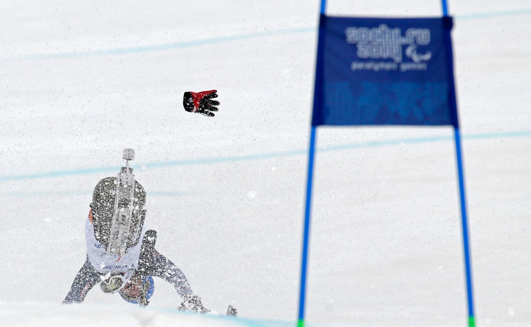 Tyler Walker of the U.S. crashes as he takes a jump during the men's sitting skiing downhill at the 2014 Sochi Paralympic Winter Games at the Rosa Khutor Alpine Center
