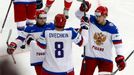 Russia's Alexander Ovechkin (C) celebrates his goal against Switzerland with team mates Yegor Yakovlev (L) and Anton Belov (R) during their men's ice hockey World Champio