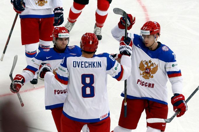 Russia's Alexander Ovechkin (C) celebrates his goal against Switzerland with team mates Yegor Yakovlev (L) and Anton Belov (R) during their men's ice hockey World Champio