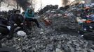 Anti-government protesters rest at a barricade in Kiev February 21, 2014.