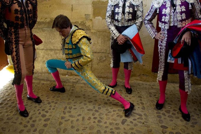 Spanish matador Antonio Barrera stretches before the start of a bullfight in The Maestranza bullring in Seville