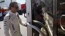 .Williams F1 driver Felipe Massa opens a door in the paddock.