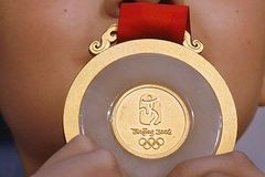 Tak vypadají medaile pro čínskou olympiádu