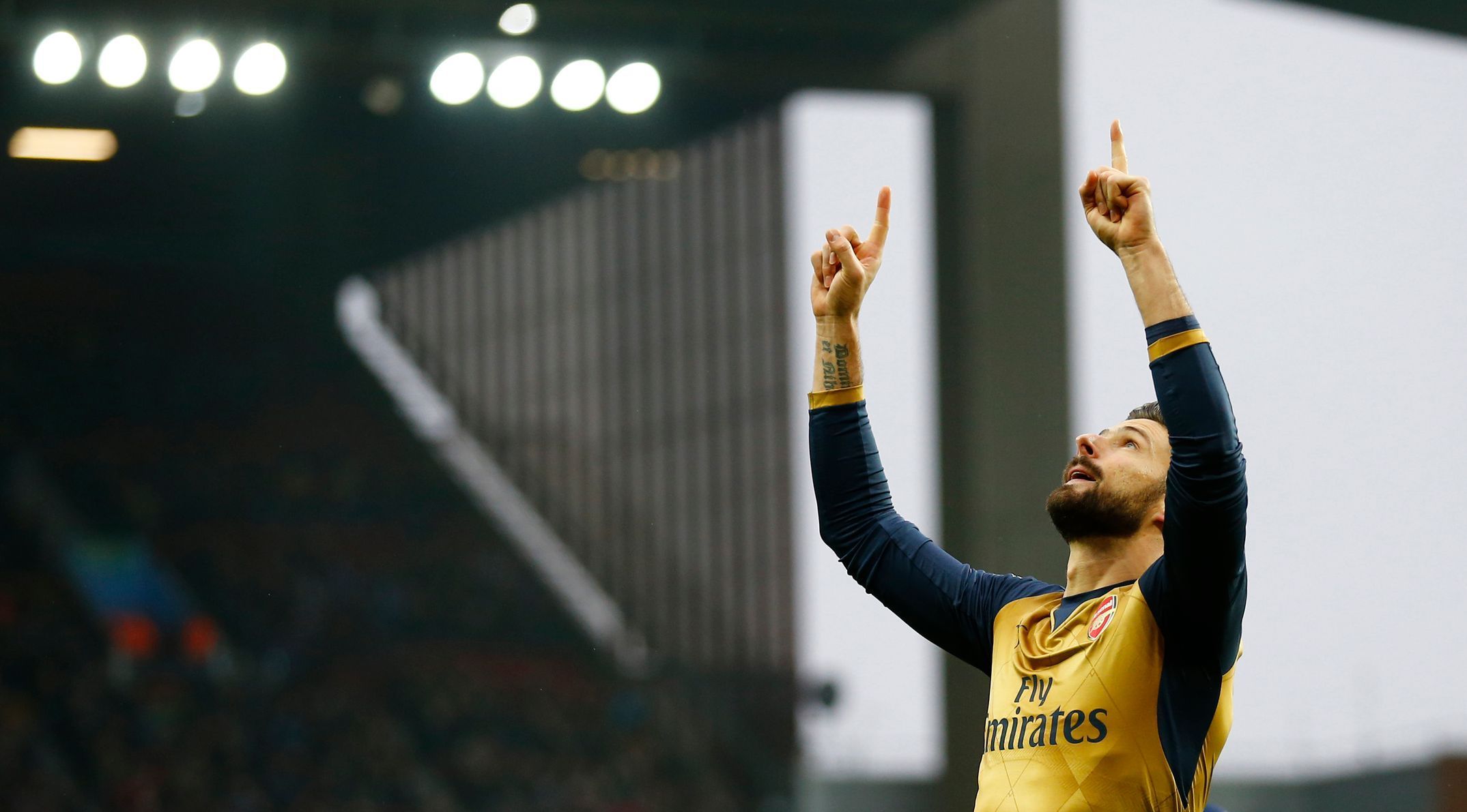 Olivier Giroud celebrates after scoring the first goal for Arsenal from the penalty spot