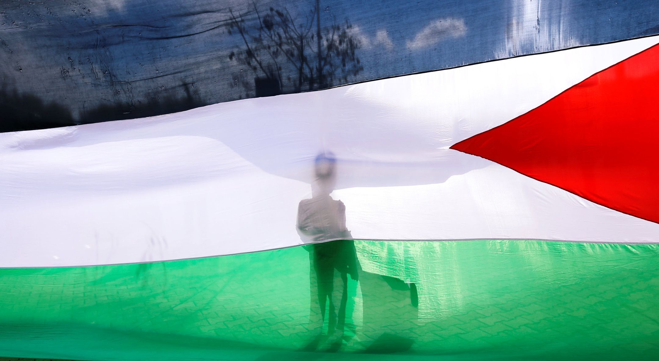 Protesty kvůli otevření americké ambasády v Jeruzalémě. Palestinská vlajka.