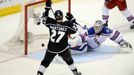 Jun 13, 2014; Los Angeles, CA, USA; Los Angeles Kings defenseman Alec Martinez (27) scores the game-winning goal past New York Rangers goalie Henrik Lundqvist (30) during