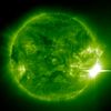 This is an image of the extremely powerful solar flare on November 4, 2003, taken by the SOHO spacecraft. The image reveals hot gas in the solar atmosphere in false color, and the flare is the bright, white area on the right edge of the sun. The horizontal line through the flare is not real; it's just the result of the flare's intense light saturating the detector in the instrument making the image: SOHO's Extreme-ultraviolet Imaging Telescope. Credit: The European Space Agency and NASA.
