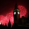 Fireworks explode behind the Houses of Parliament and Big Ben on the River Thames during New Year's celebrations in London