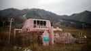 Ski lift station and decommissioned ski lift chairs are seen at the abandoned Alps Ski Resort located near the demilitarised zone separating the two Koreas in Goseong