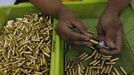 A gun factory worker fits a bullet on a chamber of a revolver at Shooters Arms, a gun manufacturing company exporting different kinds of weapons to other countries, in Cebu city in central Philippines July 6, 2012. In the Philippines, they vote with their trigger fingers. Elections mean big business for illegal gunsmiths, who are looking forward to 2013 mid-term polls. With election-related violence commonplace, the Philippines imposes a ban on the carrying of guns for six months, from campaigning to the proclamation of winners. Picture taken July 6, 2012. To match Feature PHILIPPINES-GUNS/ REUTERS/Erik De Castro (PHILIPPINES - Tags: SOCIETY POLITICS BUSINESS CRIME LAW) Published: Čec. 29, 2012, 1:48 dop.