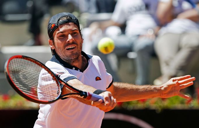 Tommy Haas of Germany hits a return to Stanislas Wawrinka of Switzerland during their men's singles match at the Rome Masters tennis tournament May 15, 2014. REUTERS/Max