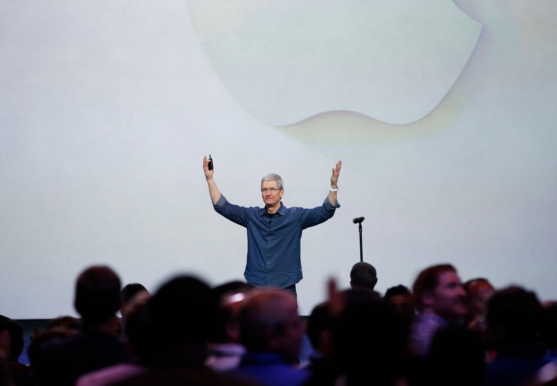 Apple CEO Tim Cook greets the audience during an Apple event announcing the iPhone 6 at the Flint Center in Cupertino