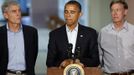 U.S. President Barack Obama (C) pauses while speaking at the University of Colorado Hospital after he met with families bereaved after a gunman went on a shooting rampage at a movie theater in Aurora, Colorado July 22, 2012. Standing beside Obama are U.S. Senator Mark Udall (L) and Colorado Governor John Hickenlooper (R). Obama headed to Aurora, Colorado, on Sunday to meet families grieving their losses Friday's mass shooting that has stunned the nation and rekindled debate about guns and violence in America. REUTERS/Larry Downing (UNITED STATES - Tags: POLITICS CRIME LAW) Published: Čec. 23, 2012, 1:16 dop.