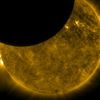 Sun and Moon On Oct. 7, 2010, NASA's Solar Dynamics Observatory, or SDO, observed its first lunar transit when the new moon passed directly between the spacecraft (in its geosynchronous orbit) and the sun. With SDO watching the sun in a wavelength of extreme ultraviolet light, the dark moon created a partial eclipse of the sun. Image Credit: NASA