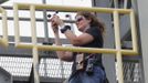 Kennedy Space Center safety officer checks the wind with an anemometer pace after mating of the space shuttle Discovery to a NASA 747 aircraft was delayed for high winds at Kennedy Space Center in Cape Canaveral