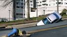 CHEVY CHASE, MD - DECEMBER 3: A utility worker looks underground to examine the scene where a sinkhole caused when a broken water main collapsed part of Friendship Blvd. on December 3, 2010 in Chevy Chase, Maryland. No one was reported injured in the accident. Logan Mock-Bunting