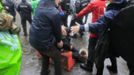 A man lays injured during riots between policemen and Arcelor Mittal workers from several Liege steel plants demonstrating outside the Walloon Region parliament in Namur January 29, 2013. Arcelor Mittal, the world's largest steel producer, plans to shut a coke plant and six finishing lines at its site in Liege, Belgium, affecting 1,300 employees, the group said last week. REUTERS/Yves Herman (BELGIUM - Tags: CIVIL UNREST BUSINESS EMPLOYMENT COMMODITIES) Published: Led. 29, 2013, 2:24 odp.