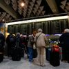 Passengers wait in front of check-in machines of German air carrier Lufthansa at Fraport airport in Frankfurt
