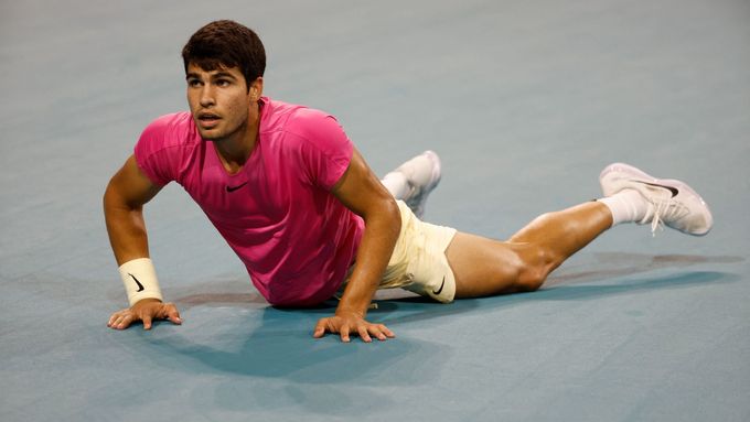 Mar 31, 2023; Miami, Florida, US; Carlos Alcaraz (ESP) falls to the court after diving for a shot against Jannik Sinner (ITA) (not pictured) in a men's singles semifinal