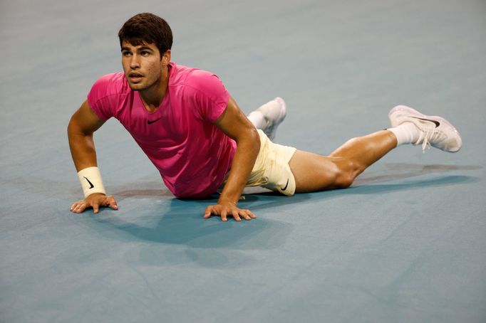 Mar 31, 2023; Miami, Florida, US; Carlos Alcaraz (ESP) falls to the court after diving for a shot against Jannik Sinner (ITA) (not pictured) in a men's singles semifinal